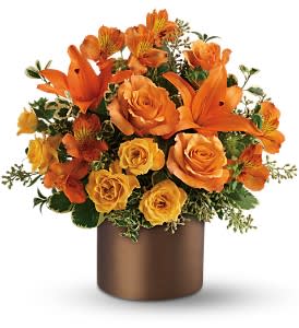 Sunset Glow - Brilliant as sunshine, ravishing orange flowers positively glow in this chic satiny cylinder vase. Imagine the surprise when this showstopper appears at the front door.