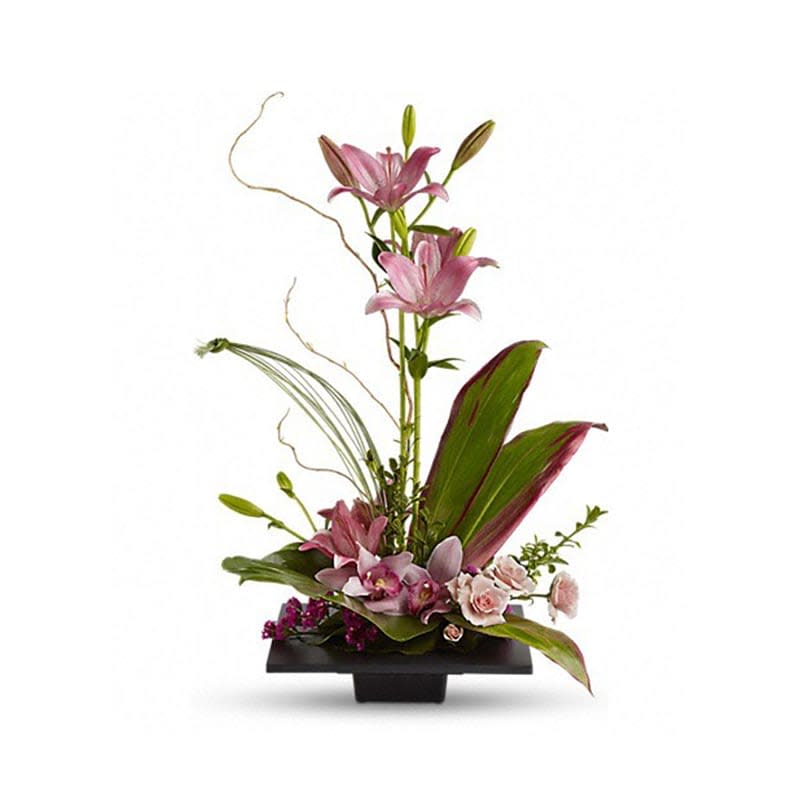 Imagination Blooms with Cymbidium Orchids [T256-1A] - This towering topiary of asiatic lilies, orchids and roses - artistically arranged with tropical greenery - is a unique gift that celebrates the spirit of creativity.  Pink asiatic lilies rise up from a square design block holding a mix of cymbidium orchids, spray roses and accent blooms and greenery.  Approximately 18" W x 27" H  Orientation: One-Sided      As Shown : T256-1A