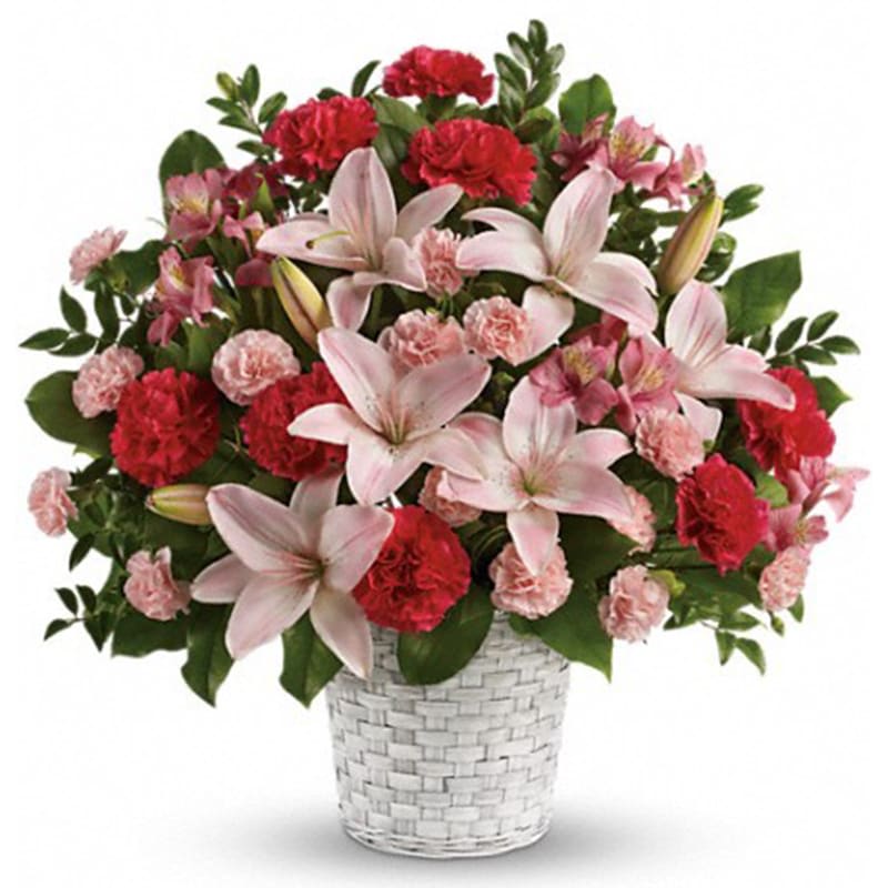 Sweet Sincerity [T258-1A] - Convey your sympathy tastefully with this lovely gift of pink floral favorites in a snowy white basket. The family will be deeply touched by your thoughtfulness.  The stunning bouquet includes pink asiatic lilies, pink alstroemeria, hot pink carnations and pink miniature carnations accented with assorted greenery. Delivered in a white pot basket.  Approximately 20" W x 20" H  Orientation: One-Sided  As Shown : T258-1A Deluxe : T258-1B Premium : T258-1C