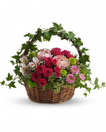 Fairest of All [T147-3A] - You won't need a mirror, mirror on the wall to decide which bouquet is the fairest of all. No doubt this beauty will win that contest!  Light orange roses, hot pink roses light pink alstroemeria, ranunculas and matsumoto asters, green button spray chrysanthemums and more are delightfully delivered in a charming ivy handled woven basket. Send one to your fair lady!  Approximately 18" W x 14" H  Orientation: All-Around      As Shown : T147-3A