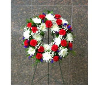 21 INCH PATRIOTIC WREATH FOR GRAVESITE [TT-ANC6] - 21" RED WHITE AND BLUE WREATH ON EASEL.  This compact fresh wreath of red carnations, white Fuji mums, statice and baby's breath comes mounted on a 36" easel.  The ideal height for placement beside headstones at Arlington National Cemetery.