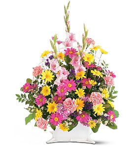 Spring Remembrance Basket [TF186-1] - This beautiful arrangement with its uplifting spring-colored flowers is perfect to send a message of hope. A touching selection for the service.  One arrangement with pink gladioli and carnations, lavender stock, white Monte Cassino asters, purple and yellow and chrysanthemums is delivered in a funeral basket with handle.  Approximately 23" W x 33" H  Orientation: One-Sided      As Shown : TF186-1  