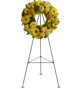 Circle of Sunshine [TFWEB545] - This sunny yellow wreath of blooms including roses, Cymbidium orchids and chrysanthemums will bring golden memories of a much-loved spirit to a wake, memorial or funeral service.  A standing wreath of fresh flowers such as roses, Cymbidium orchids, gerberas and chrysanthemums – in shades of yellow and bronze – is delivered on an easel.  Approximately 14" (W) x 14" (H) (Dimensions do not include easel.)  Orientation: One-Sided      As Shown : TFWEB545  