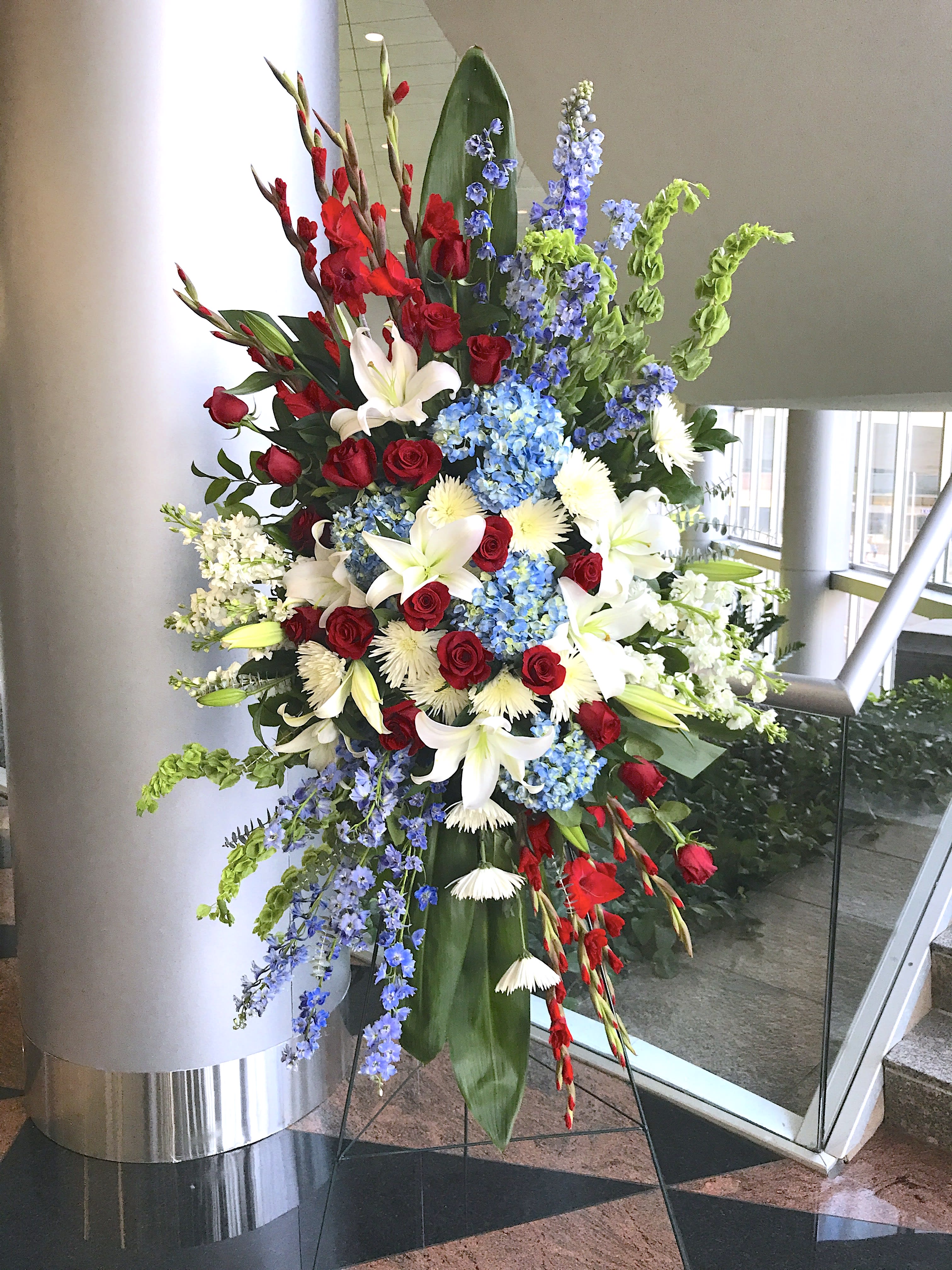 MAGNIFICENT PATRIOT'S LIFE STANDING SPRAY [TT-ANC104] - MAGNIFICENT LIFE STANDING SPRAY IN RED WHITE AND BLUE by Twin Towers Florist - Arlington, VA-       (TT-ANC104)