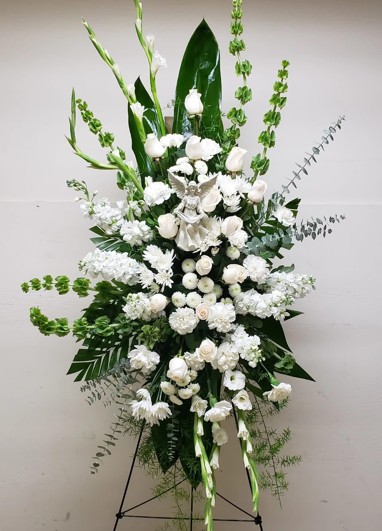[TT-ANGELSPRAY]:   ALL WHITE STANDING SPRAY WITH ANGEL FIGURINE by Twin Towers Florist, Arlington VA - ALL WHITE STANDING SPRAY WITH ANGEL FIGURINE MADE OF RESIN  BY TWIN TOWERS FLORIST IN ARLINGTON, VA