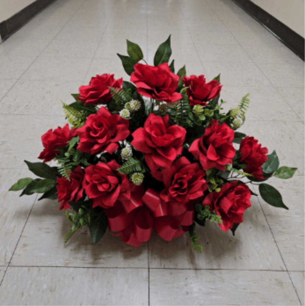 Red rose arrangement with a red ribbon bow