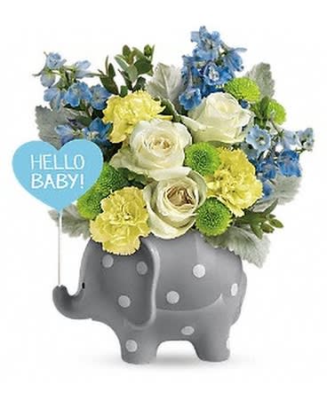 Bouquet in a gray elephant container with a "Hello Baby!" sign