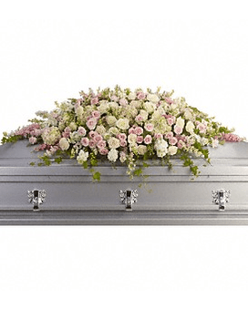 Pink and white floral casket spray on a gray casket