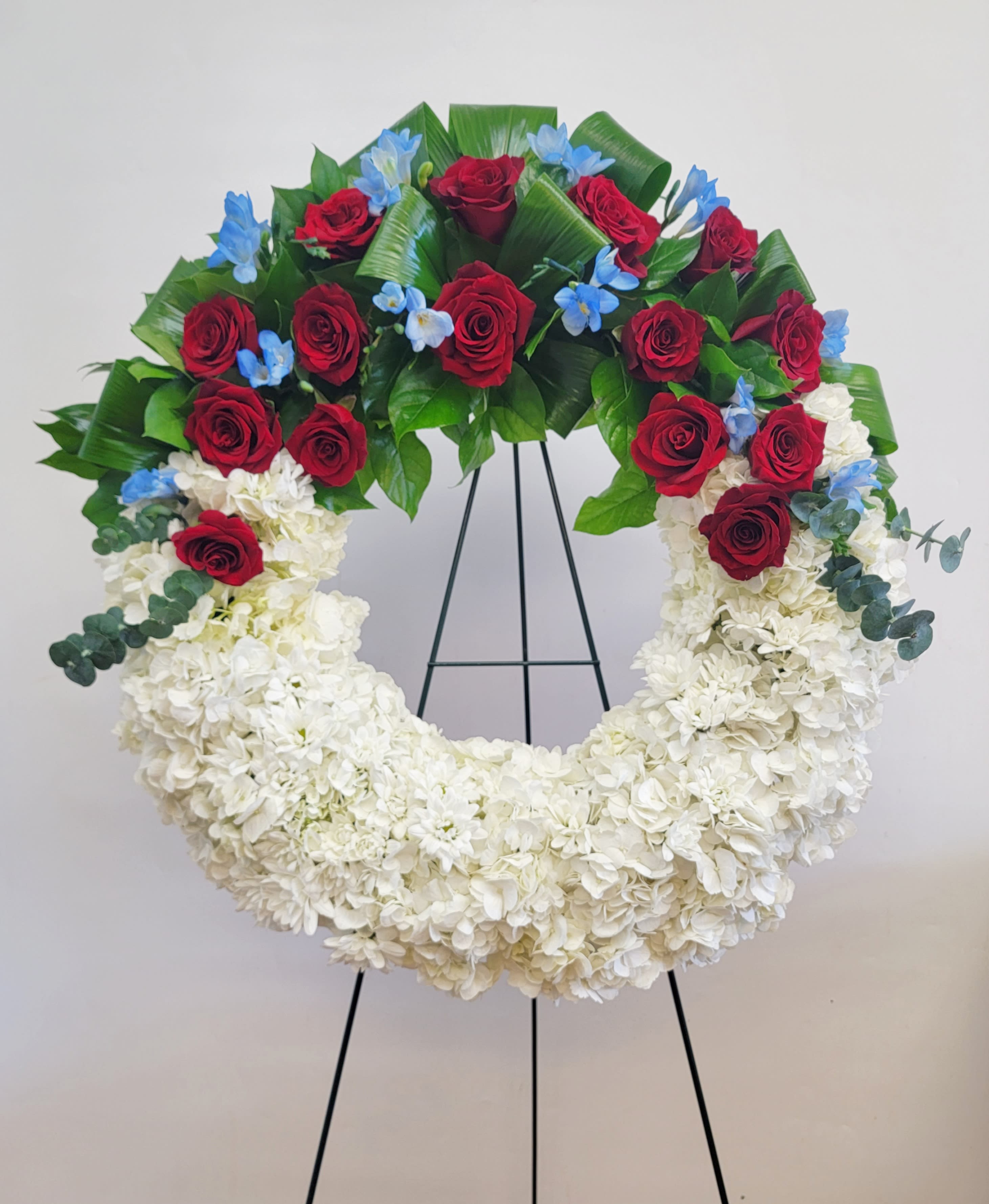 American Soul - A perfect way to honor their beliefs and actions, this red, white, and blue wreath is a tribute to those who loved their country. 