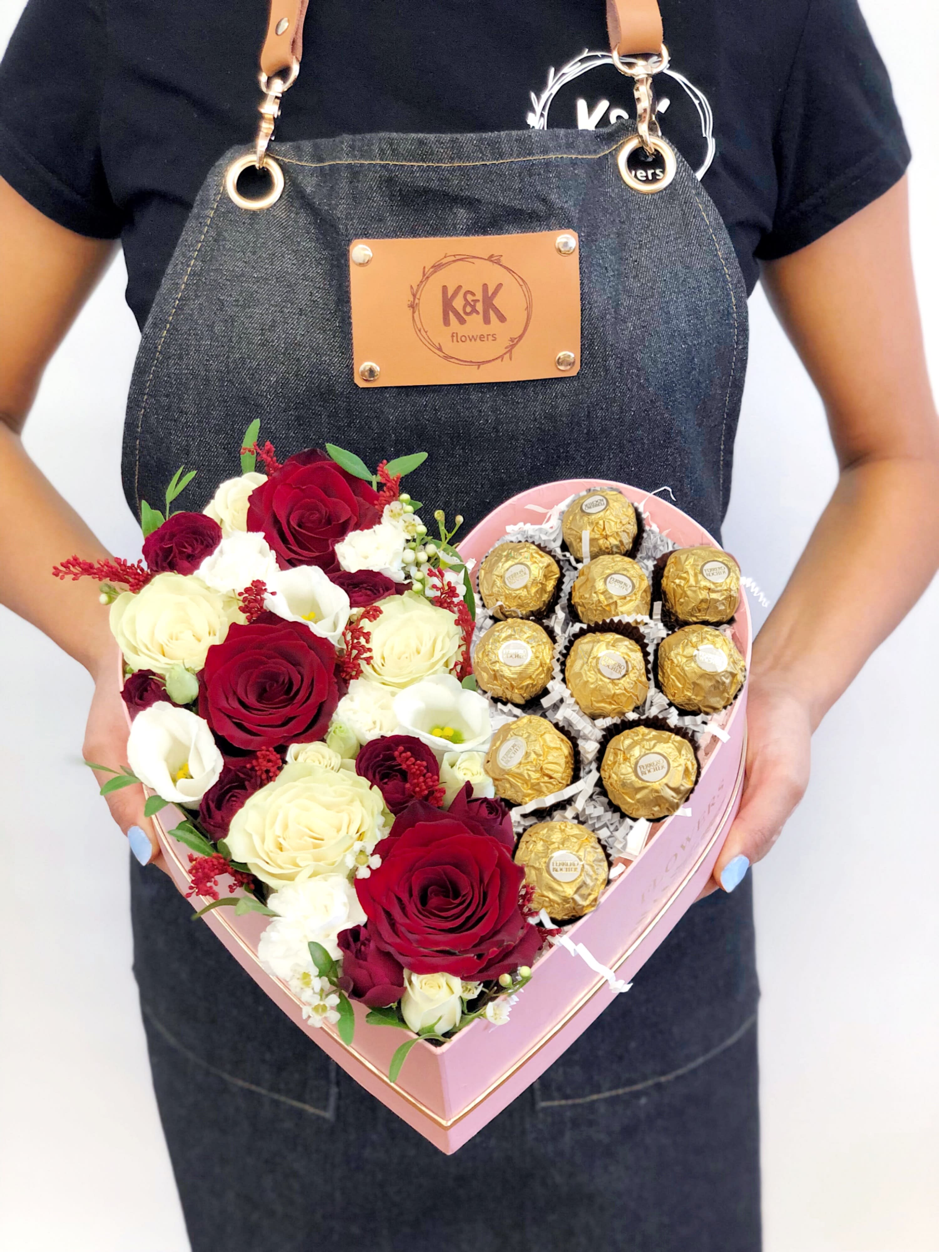 Flowers &amp; Ferrero Heart Box Red And White - Heart-shaped box filled with mixed flowers and 10 Ferrero Rocher. Mixed flowers, from romantic and gentle to an edgy and interesting look. If You want a bouquet with a twist, choose our flower boxes. We have wood boxes for rustic-looking arrangements or hat boxes for a more elegant look. It’s a beautiful and convenient way. Flowers in boxes don’t need vases. That makes it perfect for transportation and keeping flowers hydrated and secure  