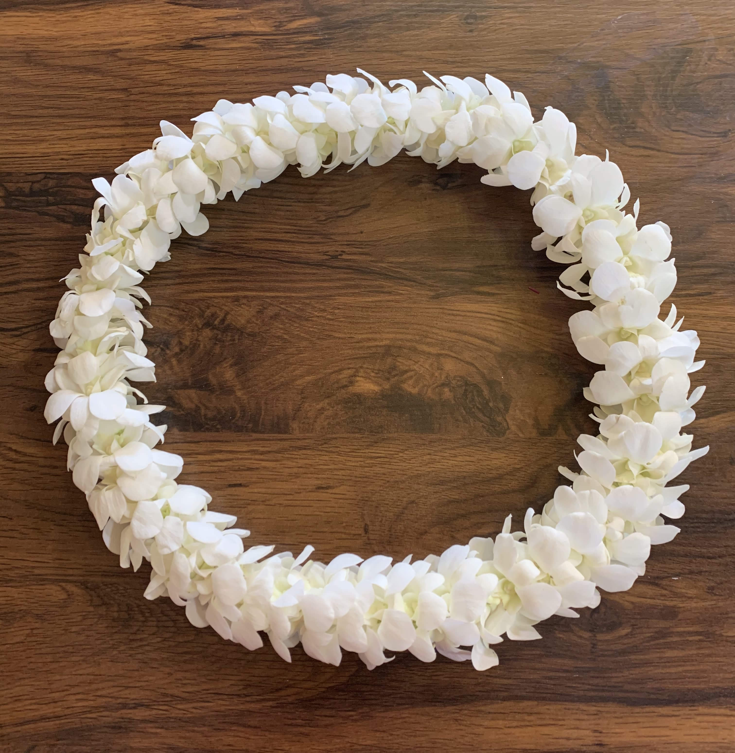 White lei - Our beautiful solid White Double Orchid Leis are handcrafted with fresh orchids and are perfect for graduations, celebrations, and special occasions. We do not make these leis in-house. Please PRE-ORDER AT LEAST A WEEK IN ADVANCE!
