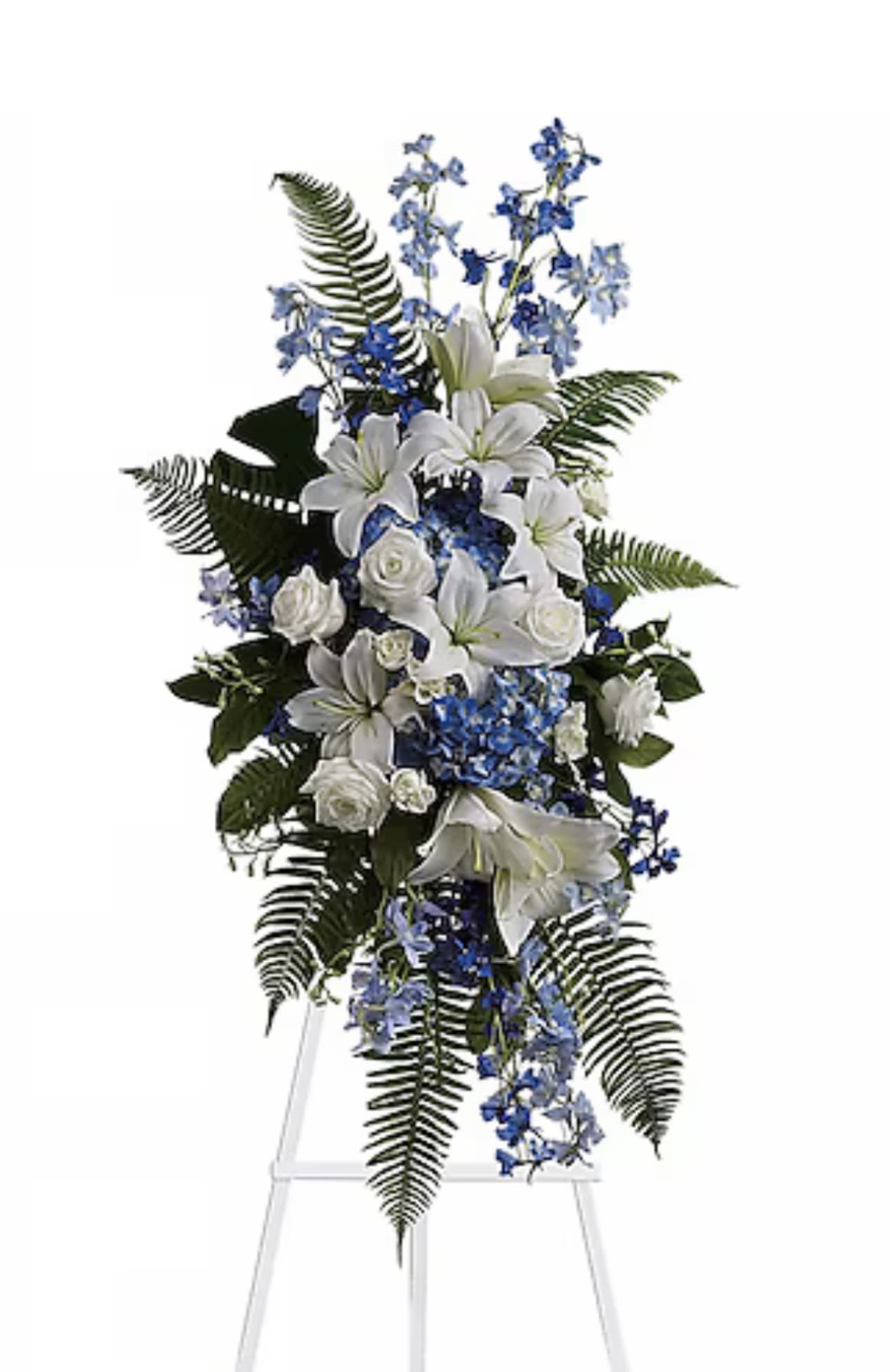 Ocean Essence Spray - A peaceful spray of white lilies and roses, blue hydrangeas and delphinium, with flowing greenery. A gentle and elegant farewell. 