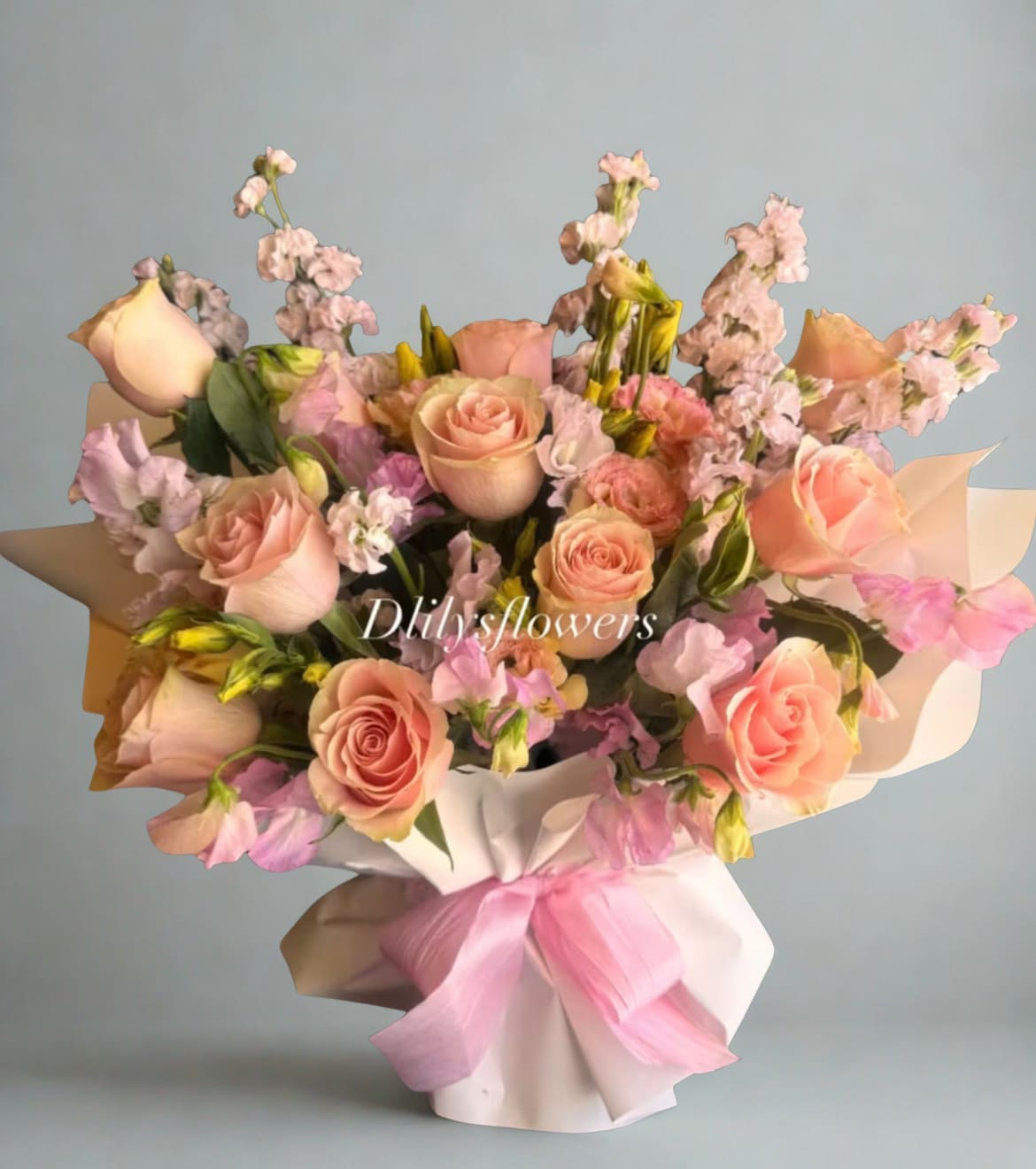Pretty in Pink  by D'Lily's Flowers  - A gorgeous bouquet made out of stunning pink roses, stock, and lisianthus. All made in a vase wrapped as a bouquet. Make someone's birthday or Get Well or Just because with these beautiful flowers! 