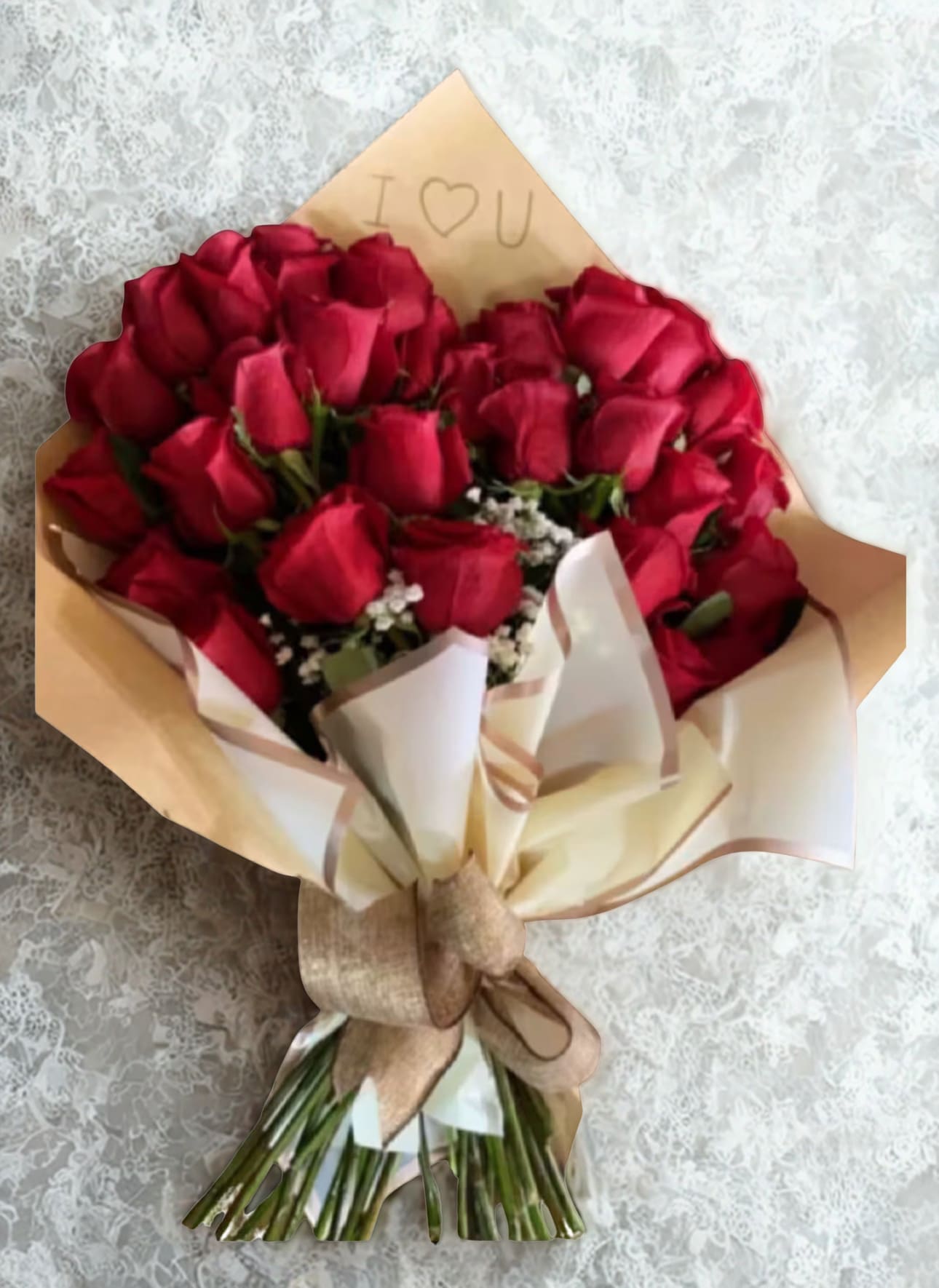  Love Bouquet  by D'Lily's Flowers  - Remind someone you love them with this 2 dozen heart shaped bouquet. Disclaimer: This is a wrapped bouquet. No Vase is Included. 