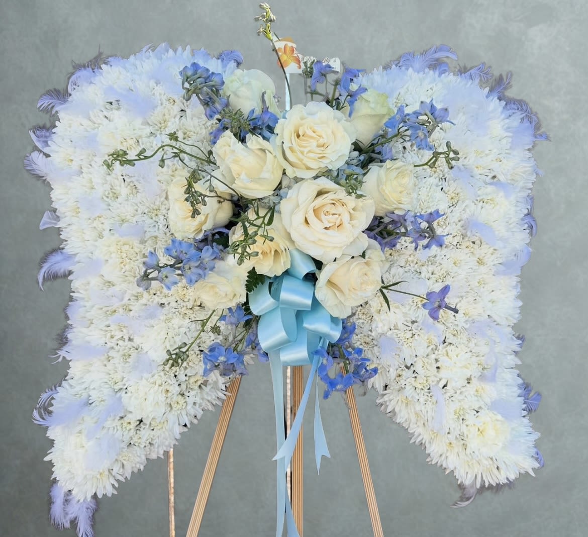 Angel wings blue - Specialty floral creations Made into an angel wings. Disclaimer :This arrangement must be pre-ordered at least 5 days in advanced.