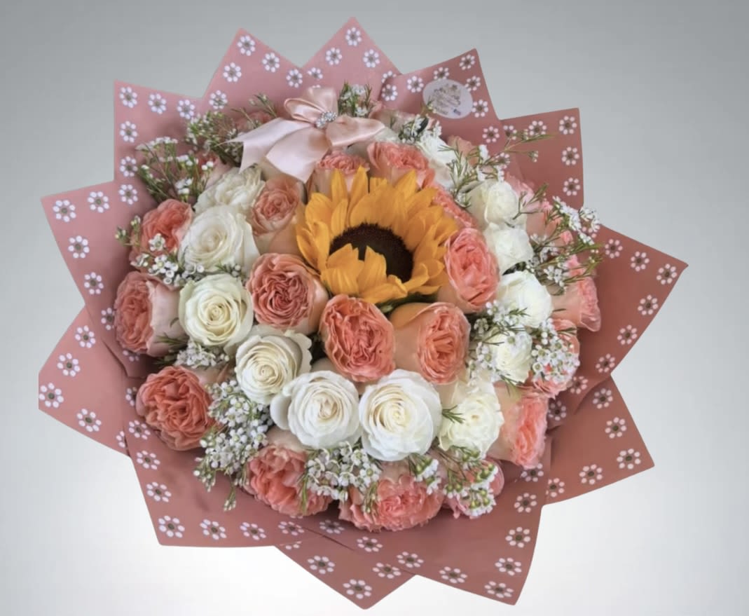 Blush Bloom Bouquet by D'Lily's Flowers  - Bring some joy with this stunning bouquet mixed with peach and white roses ! A great HBD or a simple i love you gesture!  Disclaimer: No Vase Included. 