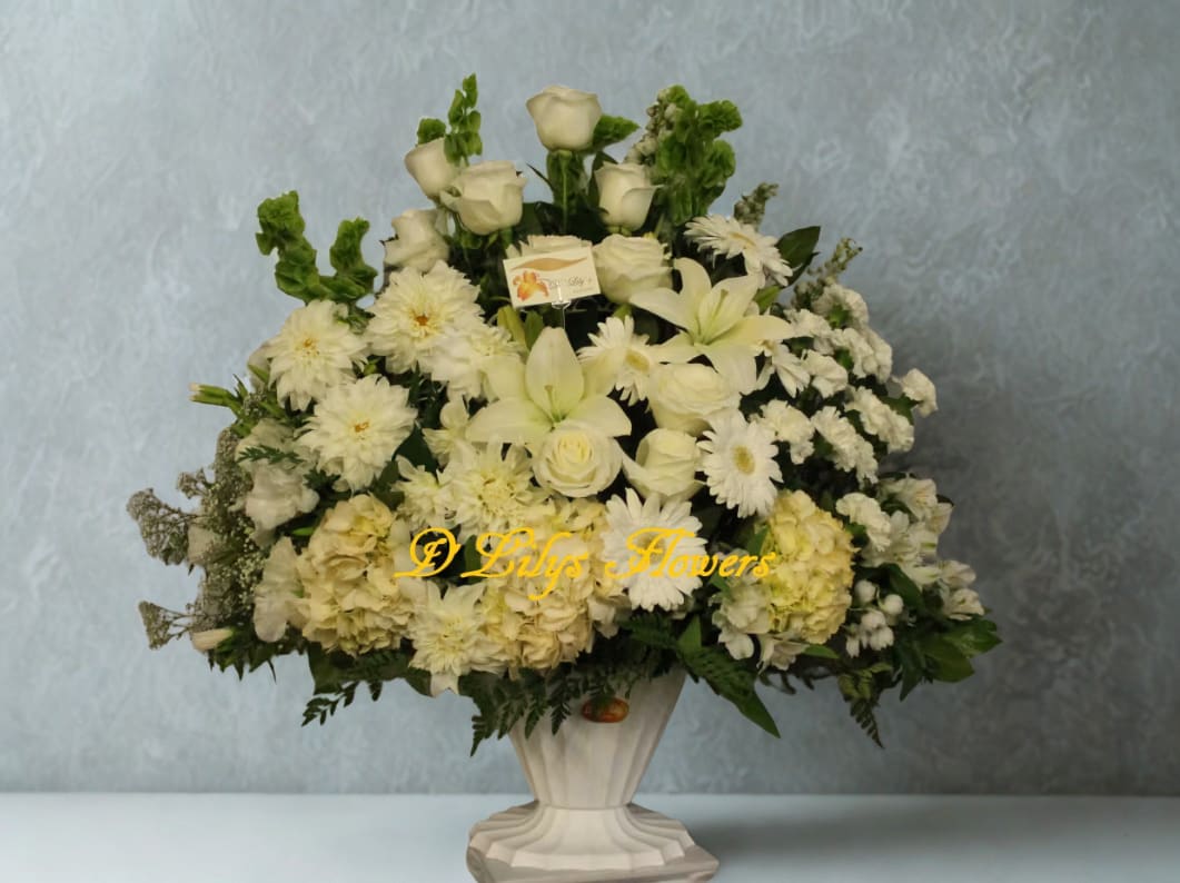 Sentiment - This pure all white flower arrangement conveys your deepest sympathies.
