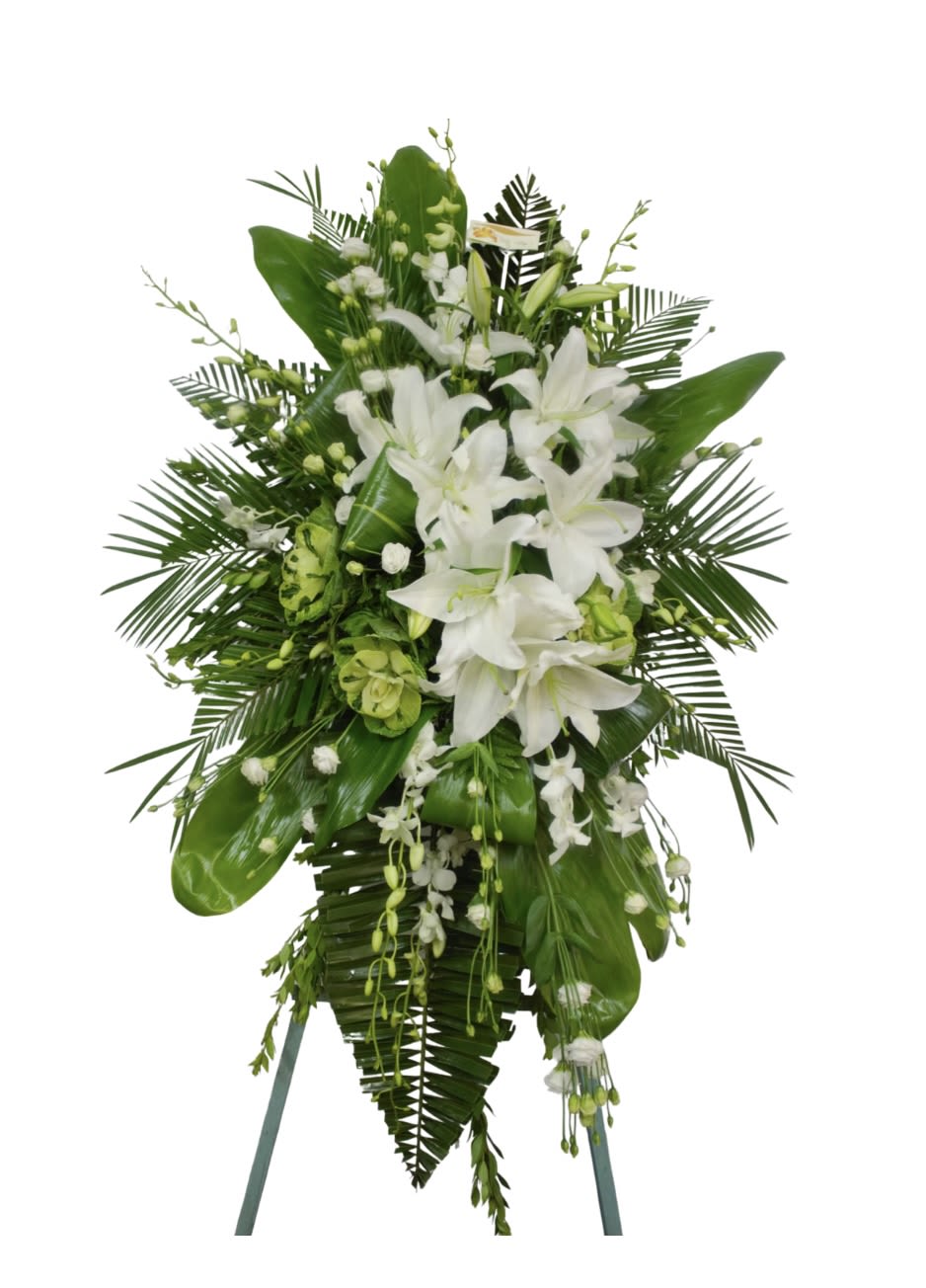 Tinker White - An all white spray with some greenery that give it a tropical feel to this display.