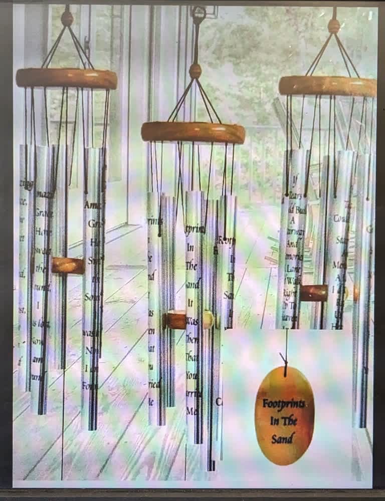Hanging metal wind chimes with wooden tops and printed tubes