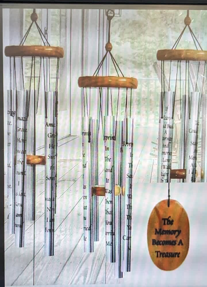 Treasured Memory Windchime - Wooden - These chimes are 40" in overall length and feature a wooden sail. Engraved on this sail you'll find the phrase, "The Memory becomes a Treasure". On the chimes themselves, you'll find the full poem.
