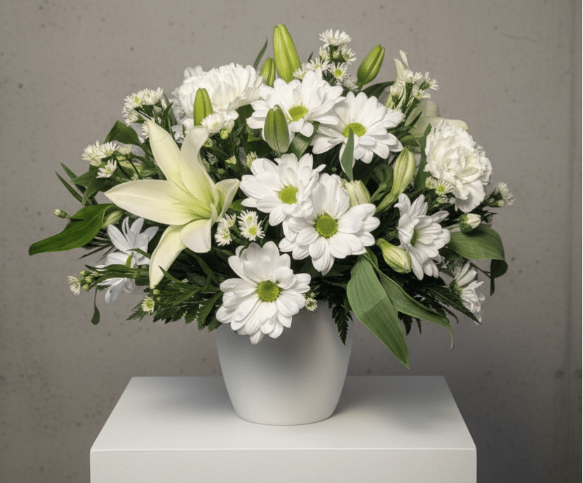 The Sweetest Kind - Simple, fresh, and full of heart—The Sweetest Kind is a charming all-white bouquet featuring white lilies, daisies, monte, alstroemeria, and carnations. Soft and serene, it's the perfect way to share a little kindness, comfort, or love.