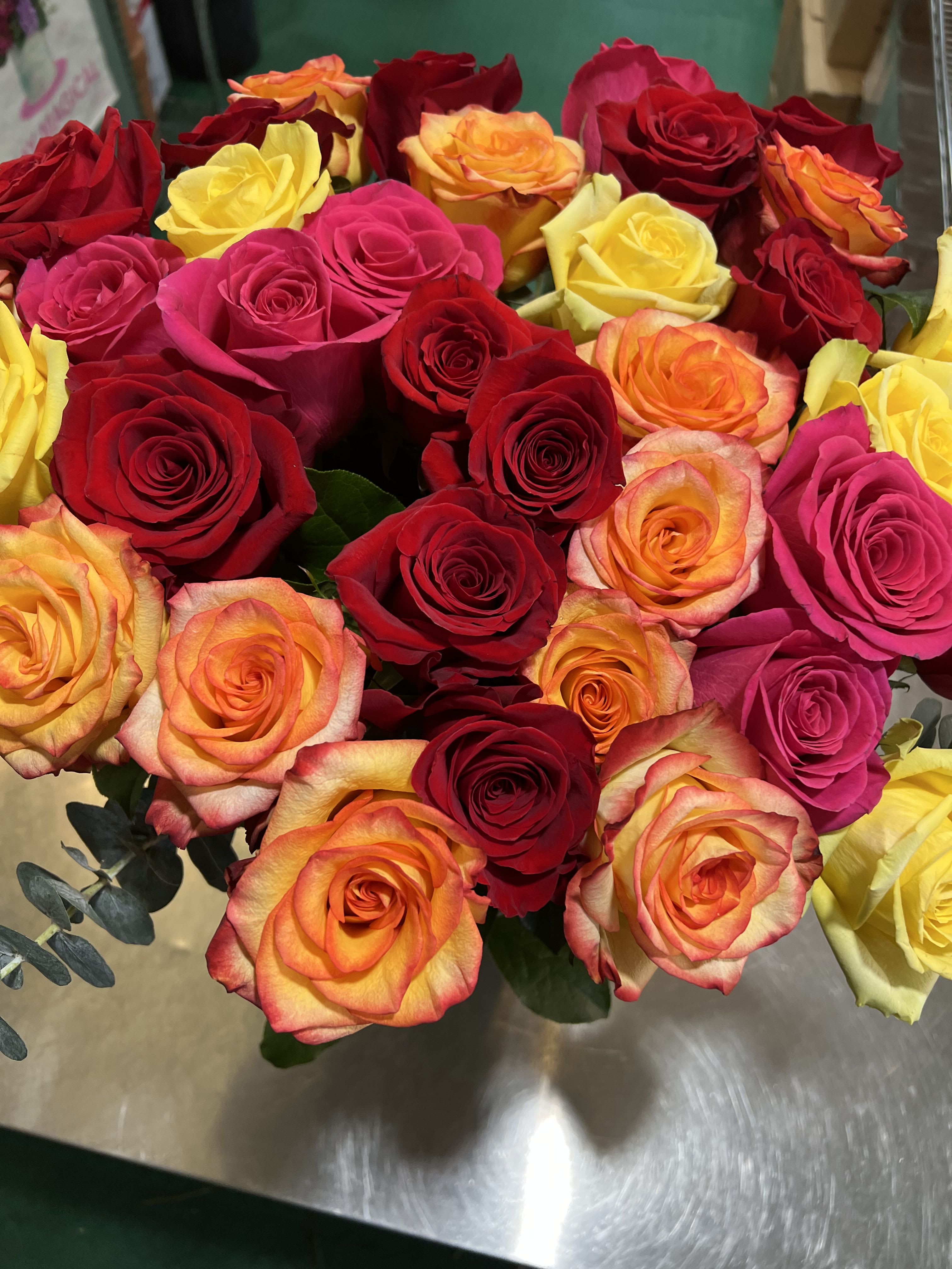 Bouquet of red, pink, yellow, and orange roses