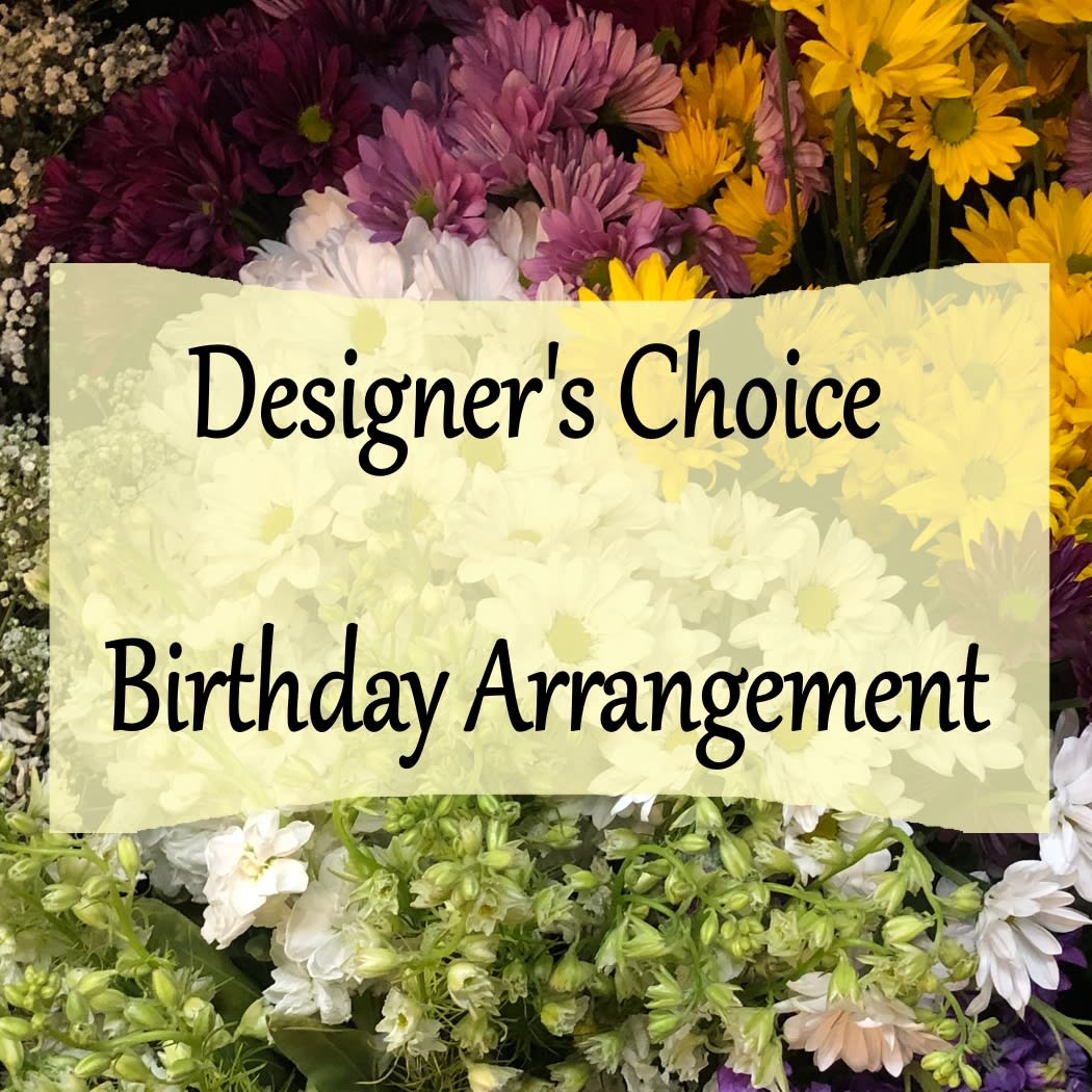 Mixed bouquet of daisies and chrysanthemums with a birthday sign
