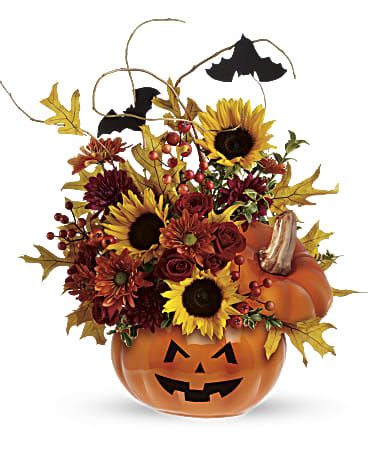Halloween pumpkin container with sunflowers, mums, and bats