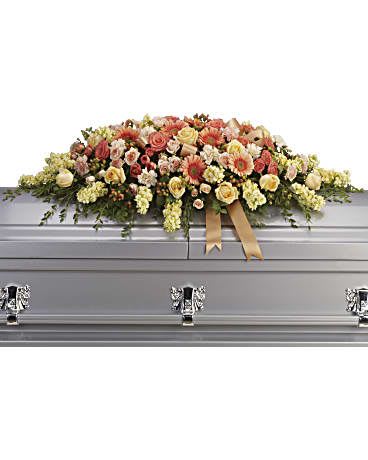 Large floral spray on a silver casket