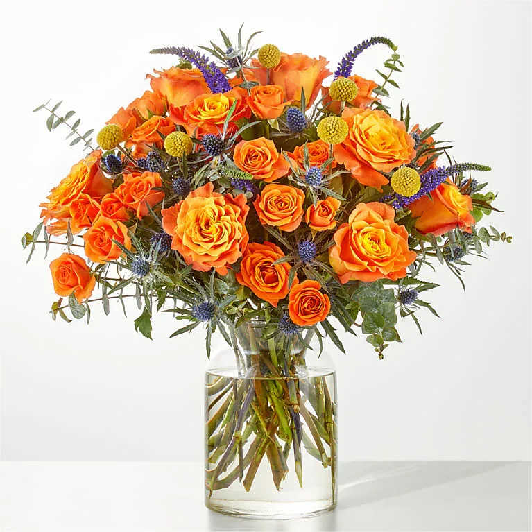 Burn Bright Bouquet - A fiery mix of florals, the Burn Bright Bouquet is an electric gift to make someone's day shine a little brighter.