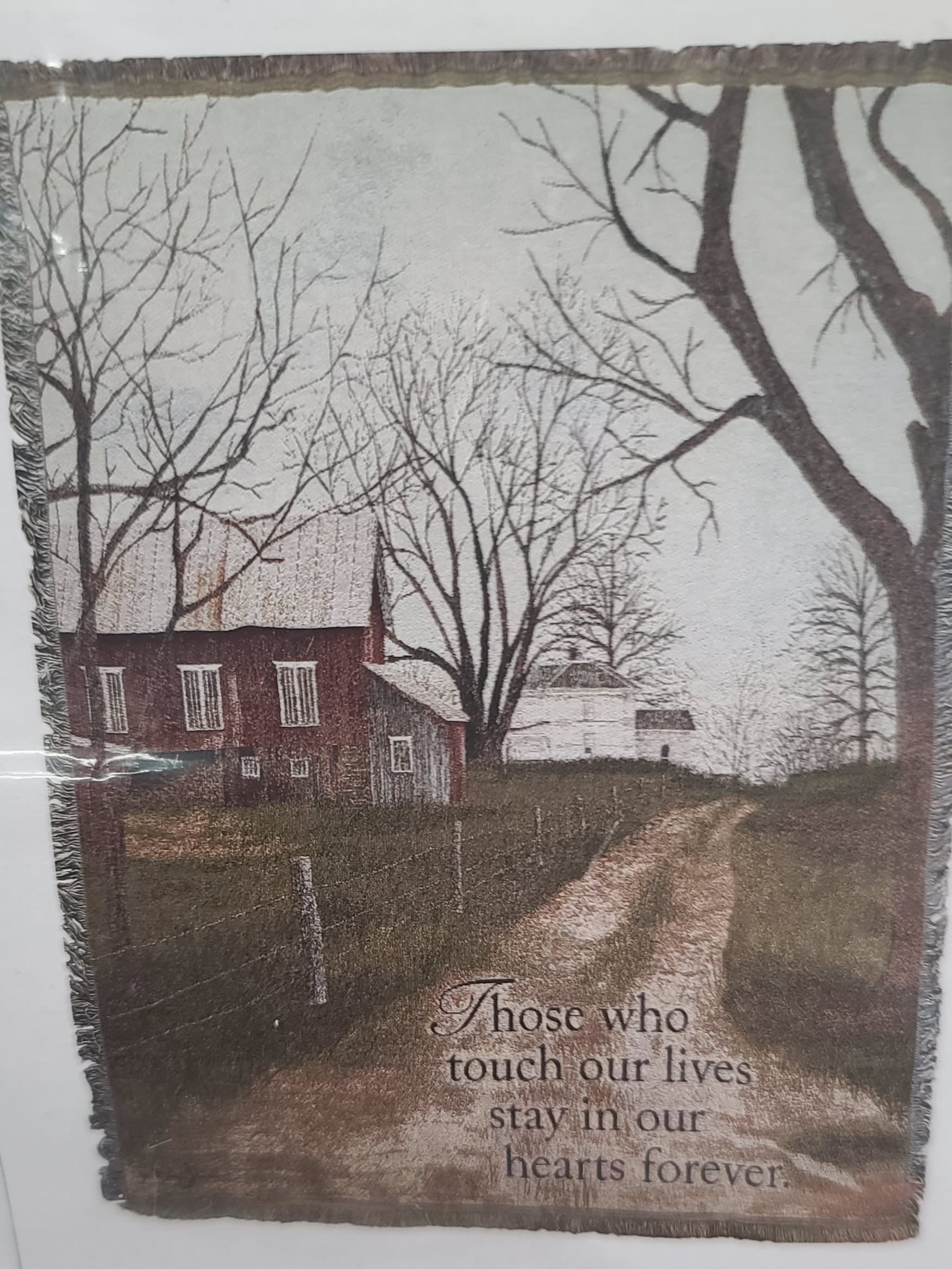 Memorial blanket with a farmhouse scene and remembrance text