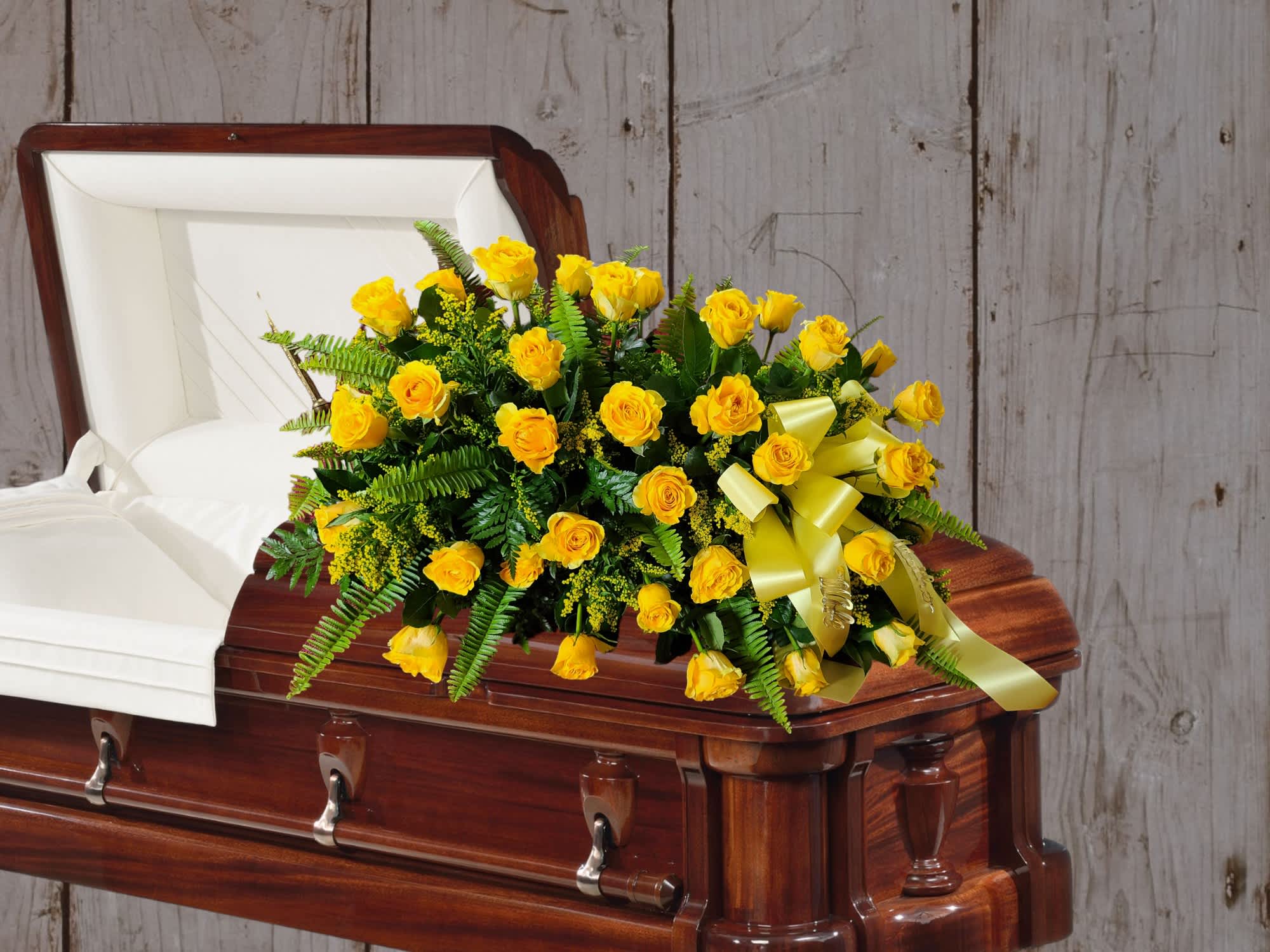 Golden Memories Casket Spray - A half couch casket spray of golden roses, solidago and accented with sword fern representing a life lived to the fullest, blessed with love, joy and laughter. 