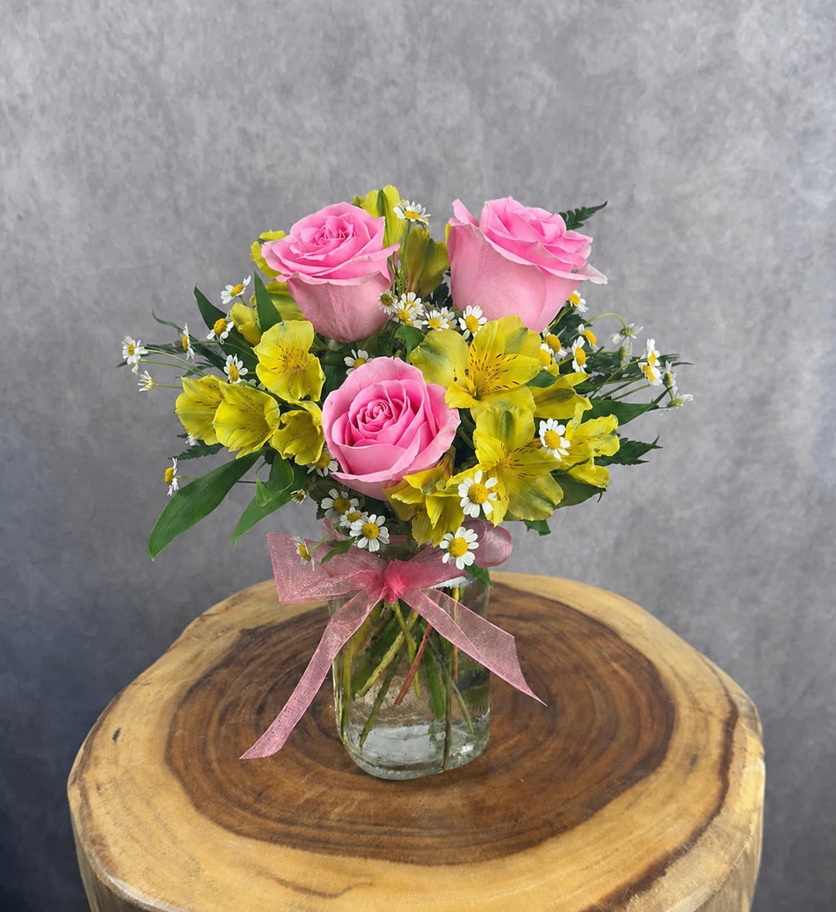 Hugs &amp; Kisses ~ Spring Edition - Petite, cheerful, and full of charm! Our popular Hugs and Kisses has been remade in the soft colors of spring.  Stands approx. 13" tall and 9" wide. Includes roses and alstroemeria.   Please Note: Standard Delivery for this product occurs in the afternoon, between 2:30pm and 7pm. If you need it by a certain time, there is an option to select a timed window for scheduled deliveries.