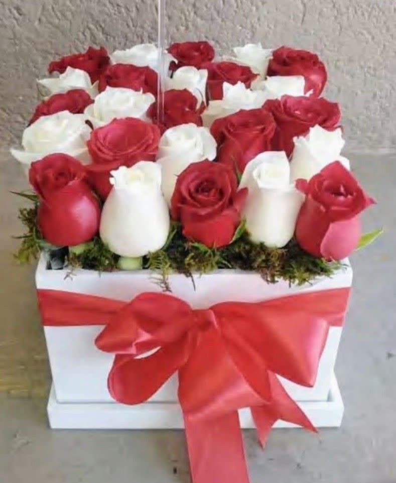 Crimson Love Rose Box - Luxury flower arrangement featuring premium red and white roses carefully designed in an elegant keepsake box by Snyder Flower Shop in San Antonio TX. Perfect for anniversaries, birthdays, romantic surprises, Valentine’s Day, proposals and special occasions with same day flower delivery in San Antonio. Our local florist specializes in luxury rose arrangements, custom flower designs and fresh premium flowers for every celebration.