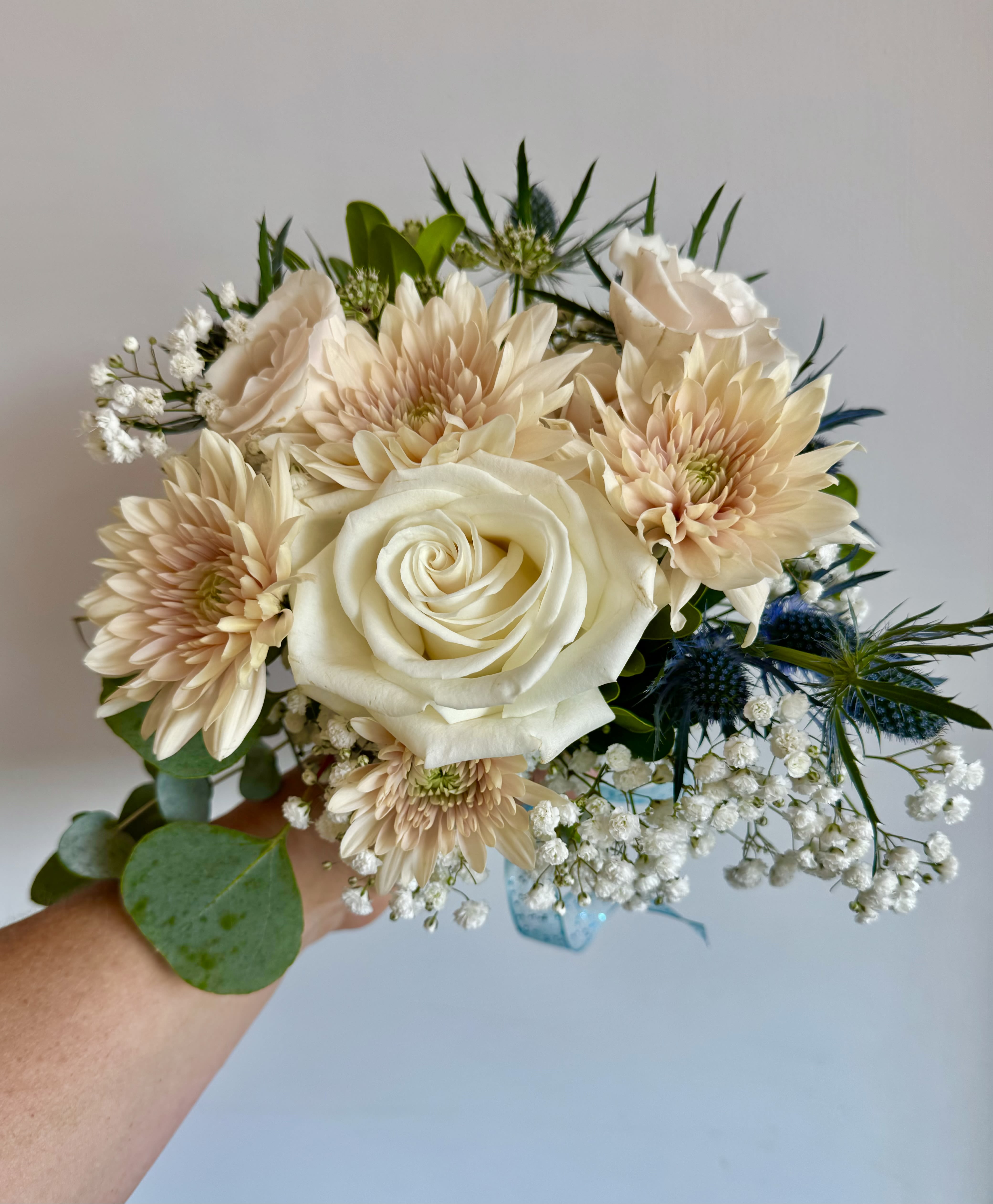 Mixed flower hand held bouquet  - Mixed flowers such as mums, roses, babies breath.  This is a great size for Prom or Homecoming hand held bouquet.  