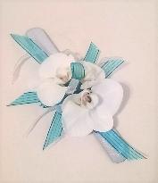 White orchid corsage with blue ribbon accents