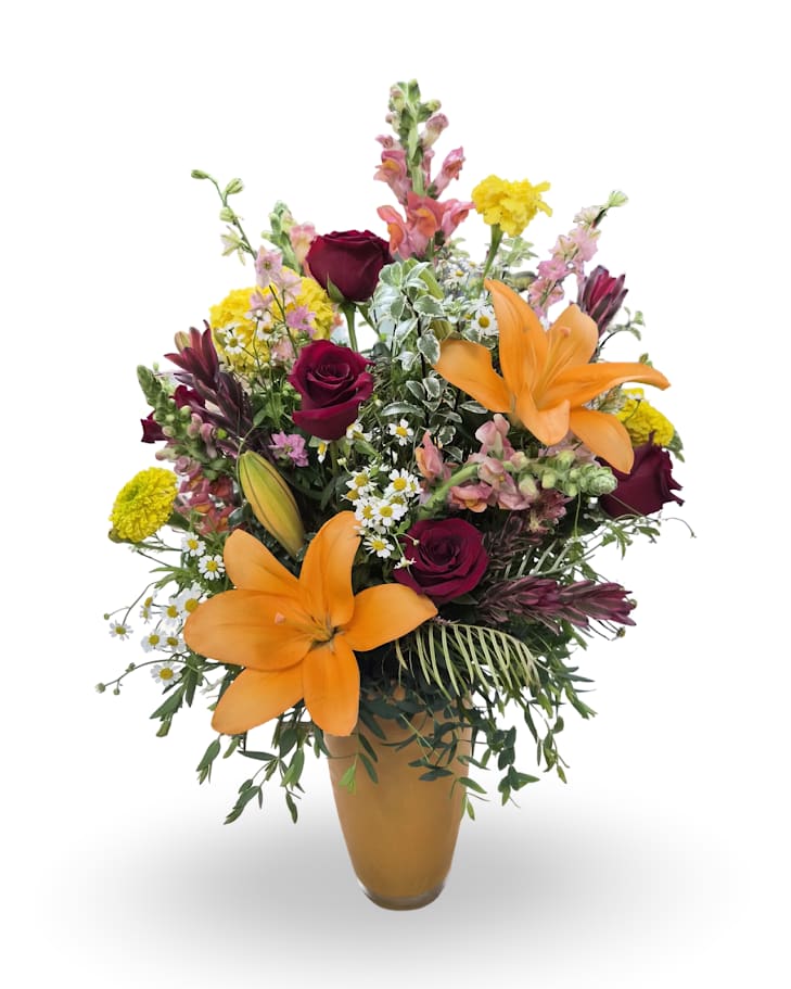 Mixed bouquet with orange lilies, burgundy roses, and yellow flowers in a vase