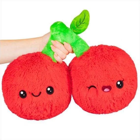 Two red plush cherry toys with smiling faces and a green stem