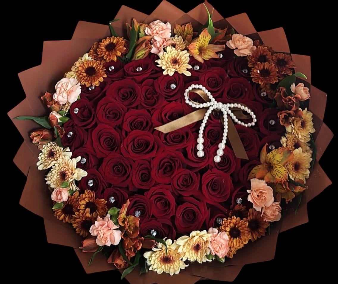 Heart-shaped bouquet of red roses with peach and yellow flowers