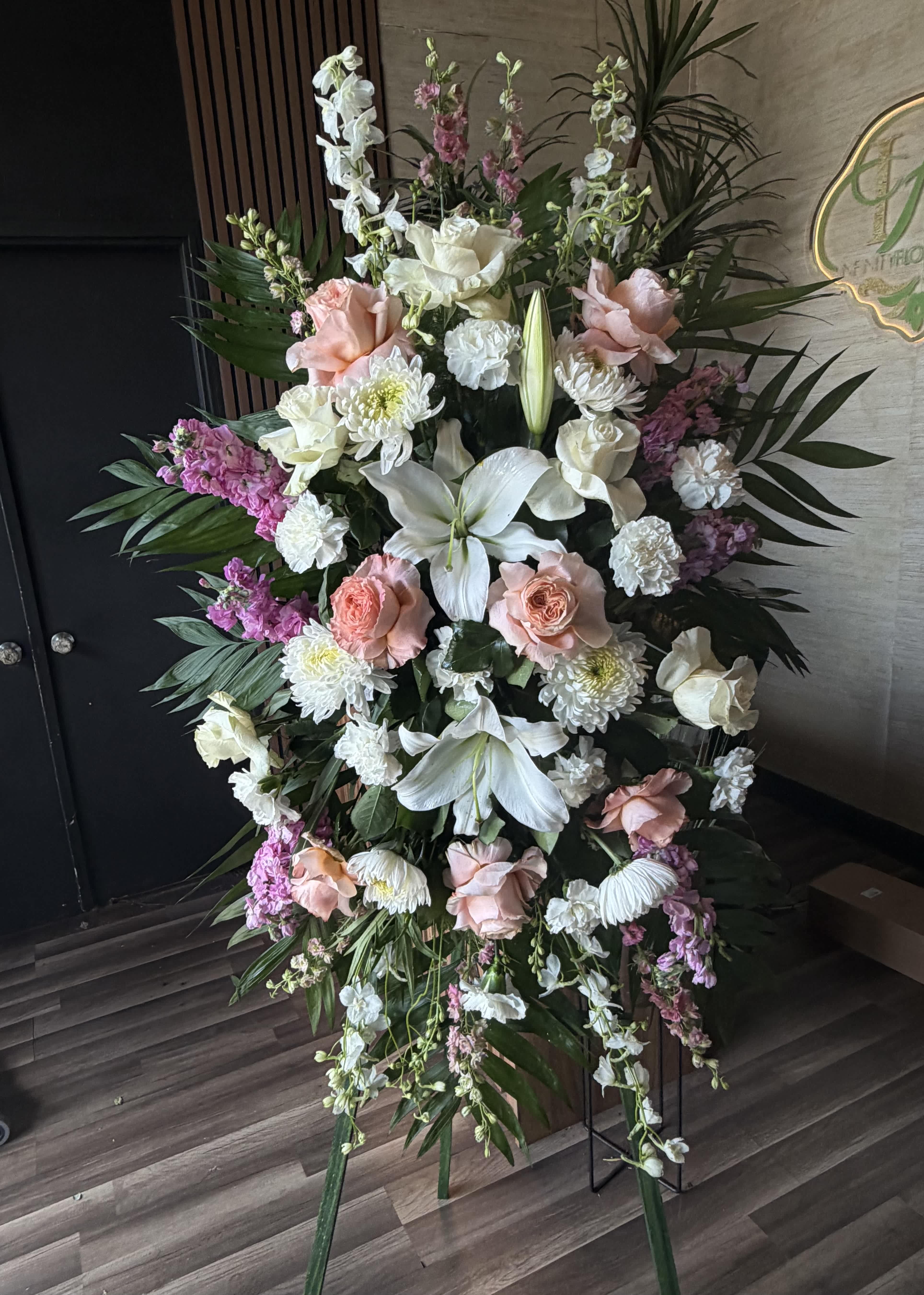 Large standing floral spray with white lilies, pink roses, and white chrysanthemums