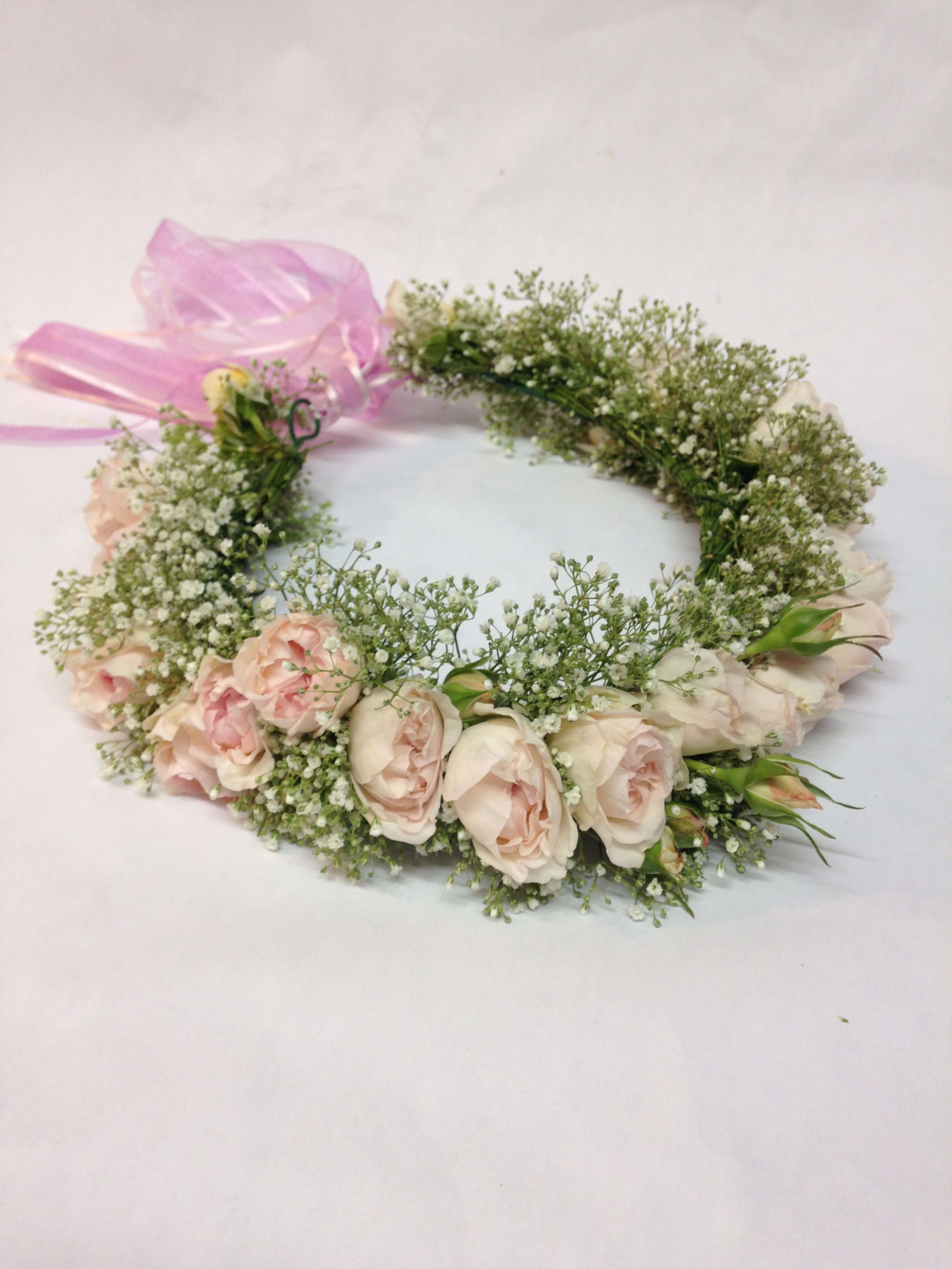 Pink rose flower crown with baby's breath and a pink ribbon