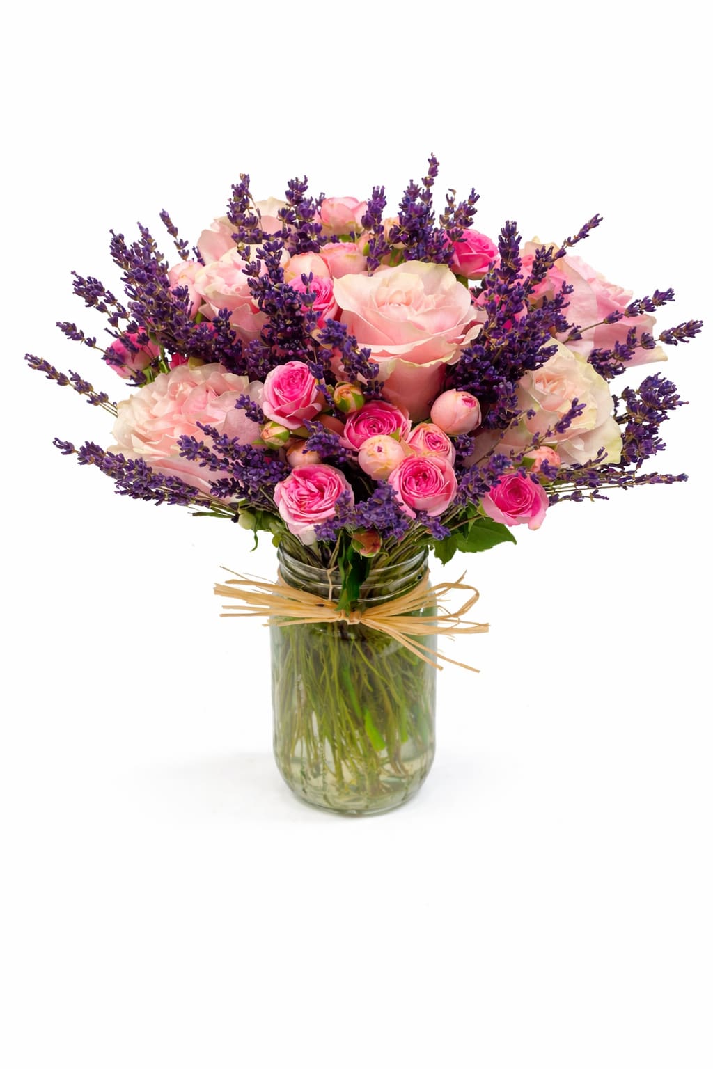 Pink roses and purple lavender in a glass jar vase