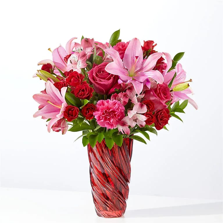 In Love Bouquet with Luxe Swirl Vase -  This lush arrangement features hot pink roses, carnations and alstroemeria to color their day.