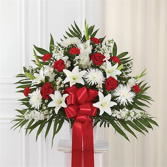 Heartfelt Sympathies™ Standing Basket- Red &amp; White - Love can help keep us going after a difficult loss. Sometimes this emotion is best expressed through a beautiful floral statement. Handcrafted by our expert florists, our majestic standing basket arrangement is filled with an array of radiant red and pure white blooms and offers heartfelt condolences when words alone aren’t enough. •Standing basket arrangement with red roses and carnations; white Asiatic lilies, spider mums, gladiola, stock and monte casino; accented with soft, lush greenery and red bow  Large measures approximately 36"H x 40"L without stand  •Medium measures approximately 34"H x 36"L without stand  •Small measures approximately 32"H x 32"L without stand