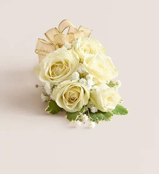 White Spray Rose Corsage - NEW A dreamy finishing touch to a wedding gown, a prom dress, or any other special-occasion finery. Consisting of carefully selected white spray roses complemented with baby’s-breath and greenery, our corsage comes with ribbon in your choice of eight colors: black, gold, green, lavender, light pink, royal blue, silver, or white. 