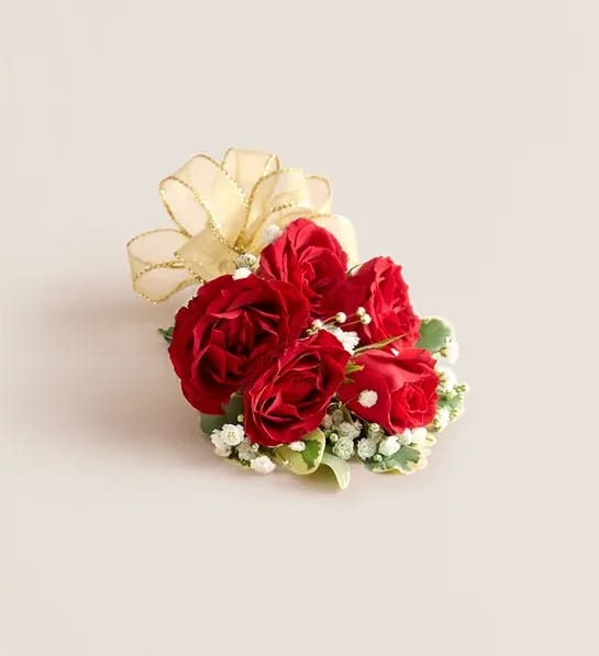 Red Spray Rose Corsage &amp; Boutonniere - NEW A dreamy finishing touch to a wedding gown, a prom dress, or any other special-occasion finery. Consisting of carefully selected pink spray roses complemented with baby’s-breath and greenery, our corsage comes with ribbon in your choice of seven colors: black, gold, light blue, light pink, purple, silver, or white