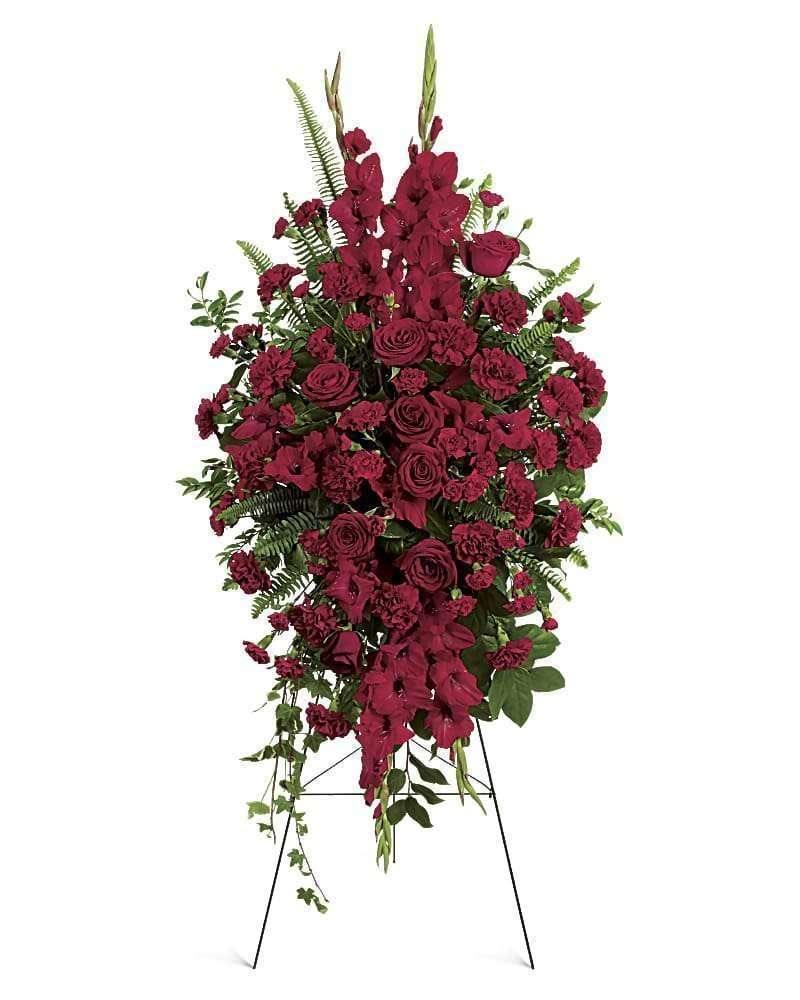 Tall red floral standing spray on an easel