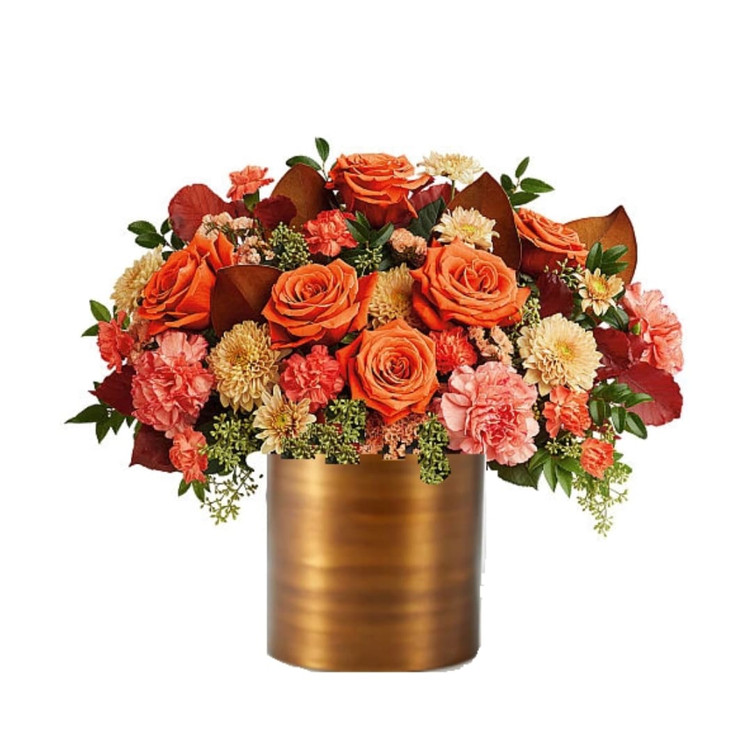 Orange roses and peach carnations in a gold vase