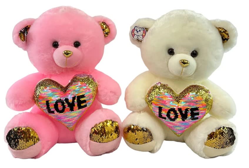 Pair of plush teddy bears, one pink and one cream, holding sequin LOVE hearts with gold accents.