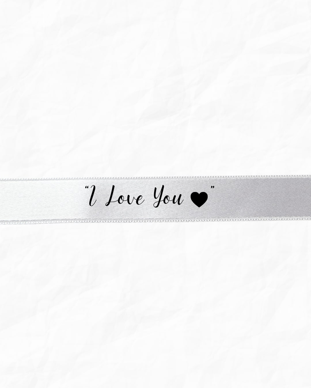 White ribbon with "I Love You" text and a heart